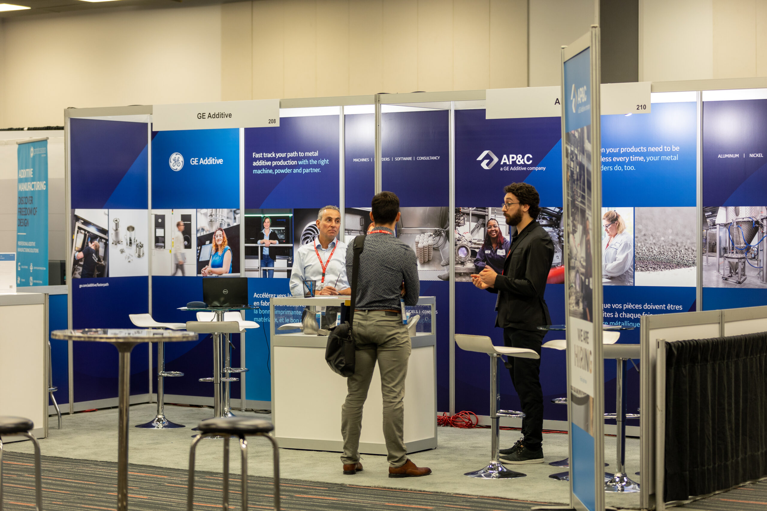 Delegates visiting AP&C's booth during HI-AM 2022 in Montreal